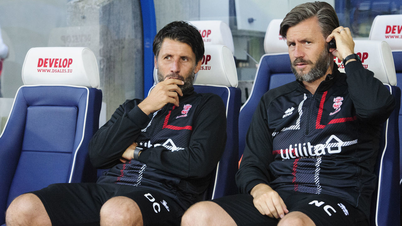 HUDDERSFIELD, ENGLAND - AUGUST 13: Lincoln City manager Danny Cowley, left, and Lincoln City's assistant manager Nicky Cowley prior to the Carabao Cup First Round match between Huddersfield Town and Lincoln City at John Smith's Stadium on August 13, 2019 in Huddersfield, England.