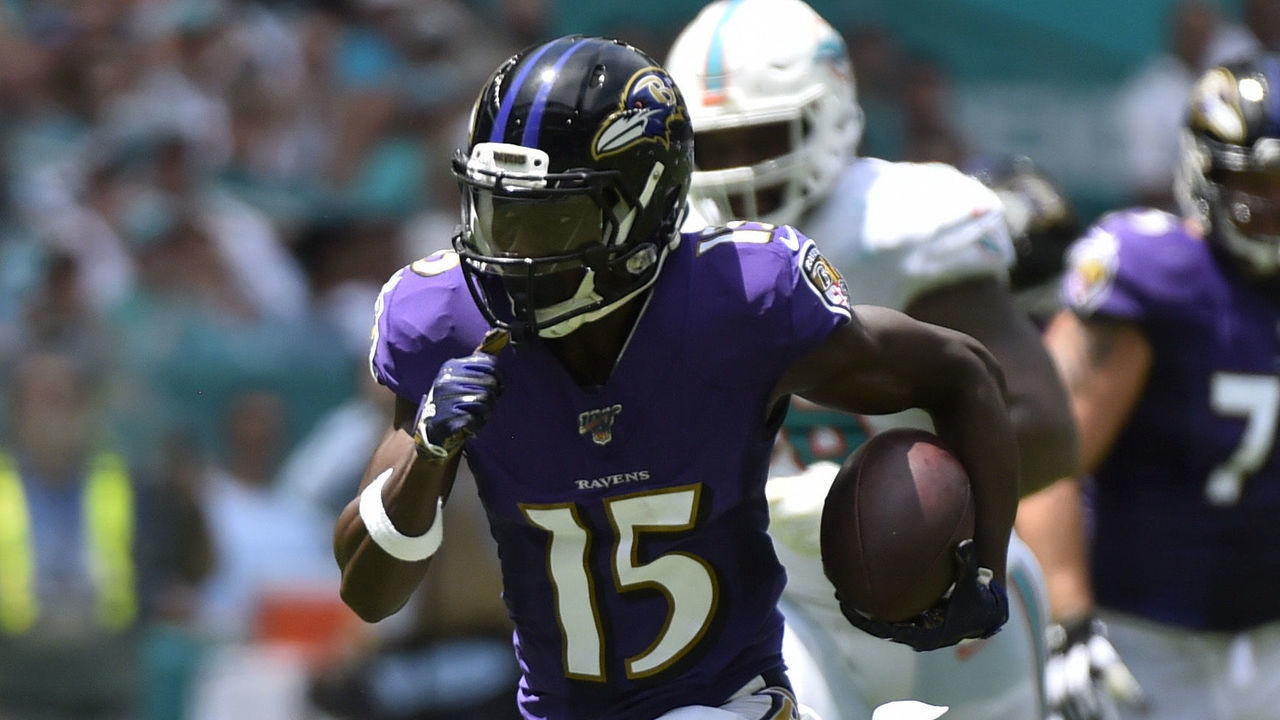 MIAMI, FL - SEPTEMBER 08: Marquise Brown #15 of the Baltimore Ravens catches a 47 yard touchdown pass from Lamar Jackson #8 in the first quarter against the Miami Dolphins at Hard Rock Stadium on September 8, 2019 in Miami, Florida.