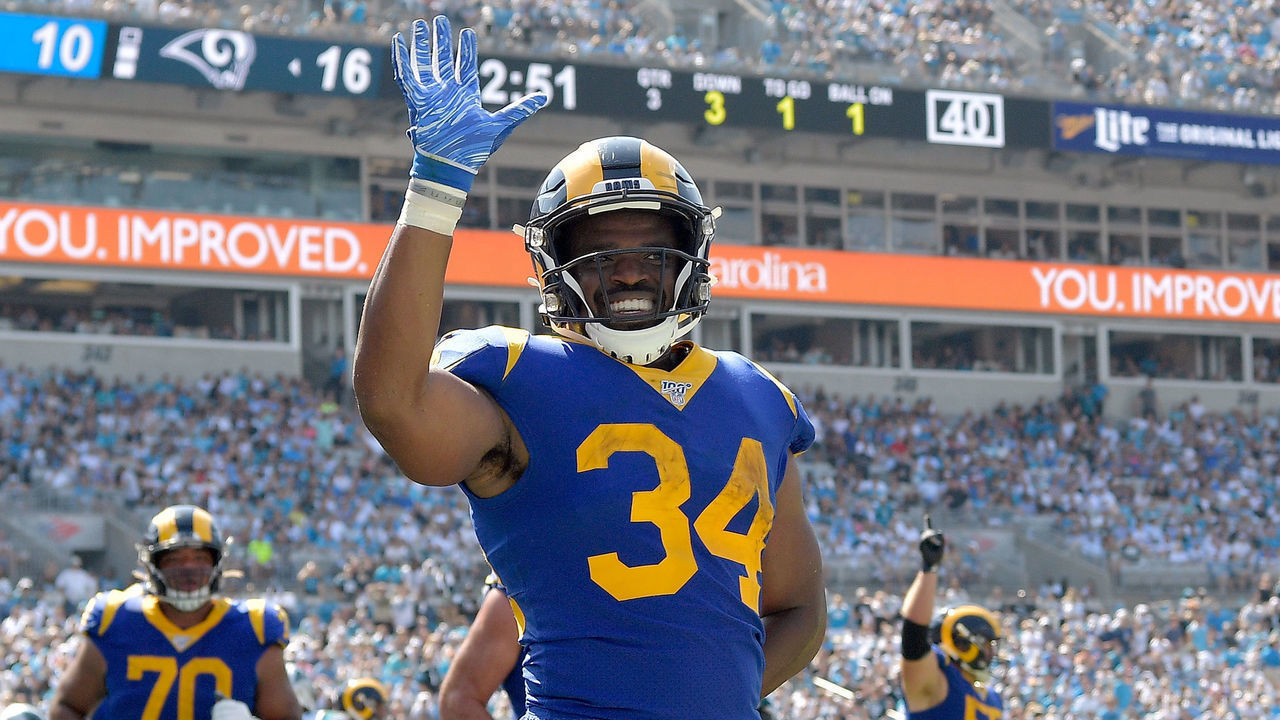 CHARLOTTE, NORTH CAROLINA - SEPTEMBER 08: Malcolm Brown #34 of the Los Angeles Rams waves to the fans after scoring a touchdown against the Carolina Panthers during the third quarter of their game at Bank of America Stadium on September 08, 2019 in Charlotte, North Carolina.