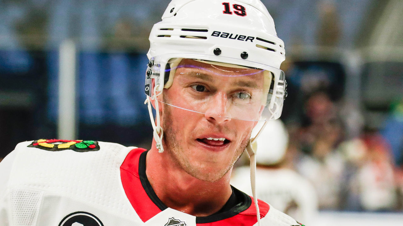 BUFFALO, NY - FEBRUARY 01: Chicago Blackhawks center Jonathan Toews (19) smiles as he converses with Buffalo Sabres right wing Kyle Okposo (21) during warmups prior to the Chicago Blackhawks and Buffalo Sabres NHL game on February 1, 2019, at KeyBank Center in Buffalo, NY.