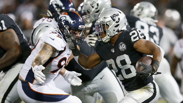 OAKLAND, CALIFORNIA - SEPTEMBER 09: Josh Jacobs #28 of the Oakland Raiders runs the ball in the second quarter against Adam Gotsis #99 of the Denver Broncos at RingCentral Coliseum on September 09, 2019 in Oakland, California.