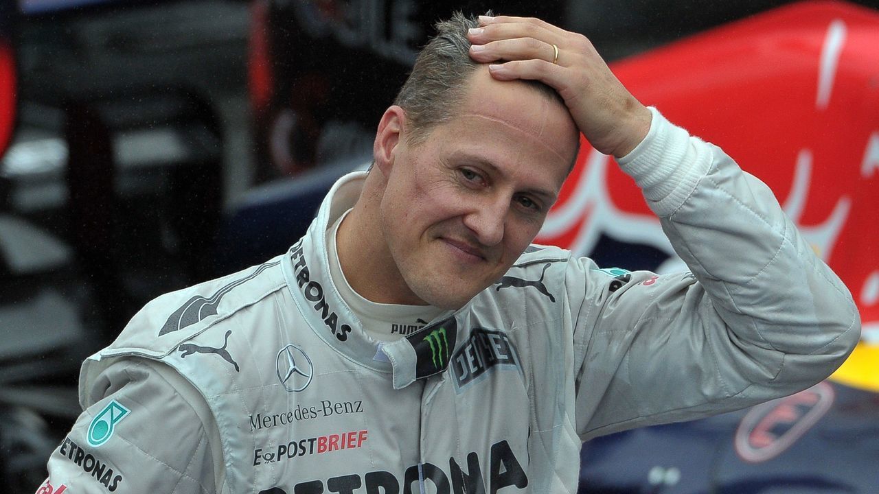 German Formula One driver Michael Schumacher gestures at the end of the Brazil's F-1 GP on November 25, 2012 at the Interlagos racetrack in Sao Paulo, Brazil. AFP PHOTO/YASUYOSHI CHIBA