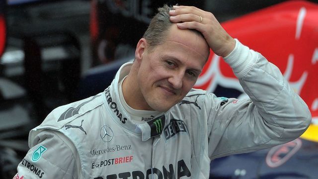 German Formula One driver Michael Schumacher gestures at the end of the Brazil's F-1 GP on November 25, 2012 at the Interlagos racetrack in Sao Paulo, Brazil. AFP PHOTO/YASUYOSHI CHIBA
