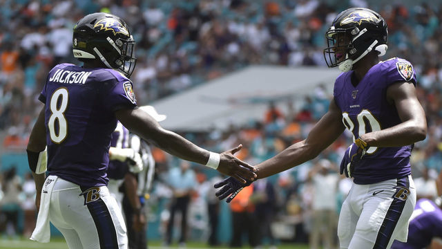 MIAMI, FL - SEPTEMBER 08: Lamar Jackson #8 of the Baltimore Ravens congratulates Miles Boykin #80 after scoring a touchdown in the second quarter against the Miami Dolphins at Hard Rock Stadium on September 8, 2019 in Miami, Florida.
