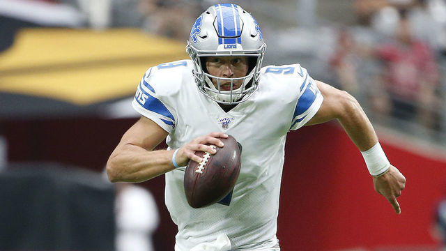 GLENDALE, ARIZONA - SEPTEMBER 08: Quarterback Matthew Stafford # 9 of the Detroit Lions scrambles out of the pocket to elude the rush of Corey Peters #98 of the Arizona Cardinals during the first half of the NFL football game at State Farm Stadium on September 08, 2019 in Glendale, Arizona.