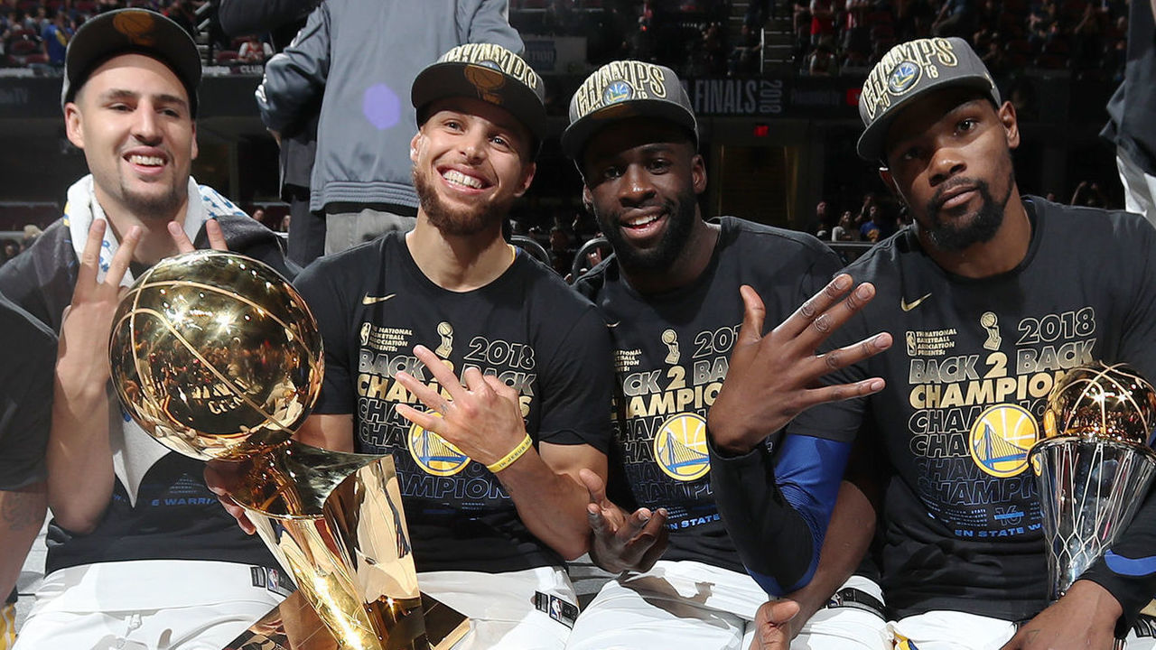 CLEVELAND, OH - JUNE 8: Andre Iguodala #9, Klay Thompson #11, Stephen Curry #30, Draymond Green #23, and Kevin Durant #35 of the Golden State Warriors pose with the Larry O'Brien Championship Trophy after Game Four of the 2018 NBA Finals against the Cleveland Cavaliers on June 8, 2018 at Quicken Loans Arena in Cleveland, Ohio. NOTE TO USER: User expressly acknowledges and agrees that, by downloading and/or using this photograph, user is consenting to the terms and conditions of the Getty Images License Agreement. Mandatory Copyright Notice: Copyright 2018 NBAE