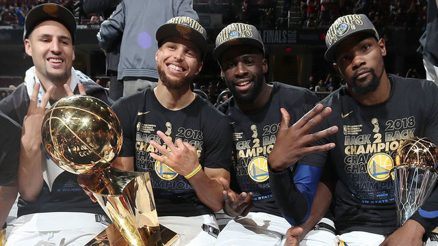 CLEVELAND, OH - JUNE 8: Andre Iguodala #9, Klay Thompson #11, Stephen Curry #30, Draymond Green #23, and Kevin Durant #35 of the Golden State Warriors pose with the Larry O'Brien Championship Trophy after Game Four of the 2018 NBA Finals against the Cleveland Cavaliers on June 8, 2018 at Quicken Loans Arena in Cleveland, Ohio. NOTE TO USER: User expressly acknowledges and agrees that, by downloading and/or using this photograph, user is consenting to the terms and conditions of the Getty Images License Agreement. Mandatory Copyright Notice: Copyright 2018 NBAE
