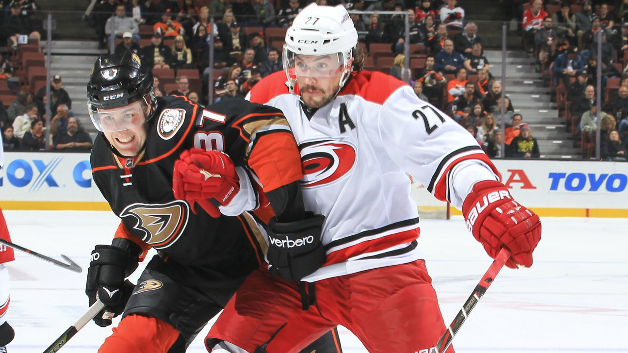 ANAHEIM, CA - DECEMBER 7: Nick Ritchie #37 of the Anaheim Ducks and Justin Faulk #27 of the Carolina Hurricanes battle for position during the game at Honda Center on December 7, 2016 in Anaheim, California. ***Local Caption ***