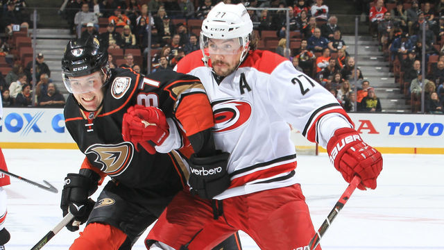 ANAHEIM, CA - DECEMBER 7: Nick Ritchie #37 of the Anaheim Ducks and Justin Faulk #27 of the Carolina Hurricanes battle for position during the game at Honda Center on December 7, 2016 in Anaheim, California. ***Local Caption ***