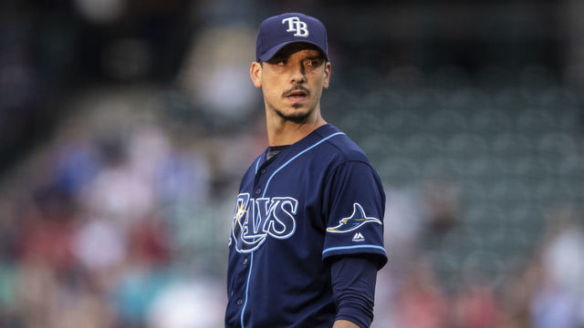 SEATTLE, WA - AUGUST 10: Starting pitcher Charlie Morton #50 of the Tampa Bay Rays looks toward home plate for signs during a game Seattle Mariners at T-Mobile Park on August 10, 2019 in Seattle, Washington. The Rays won 5-4.