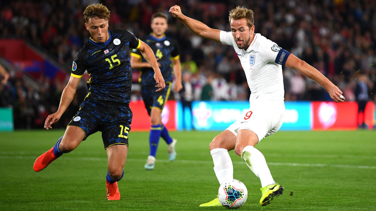SOUTHAMPTON, ENGLAND - SEPTEMBER 10: Harry Kane of England scores his sides second goal as he is closed down by Mergim Vojvoda of Bulgaria during the UEFA Euro 2020 qualifier match between England and Kosovo at St. Mary's Stadium on September 10, 2019 in Southampton, England.