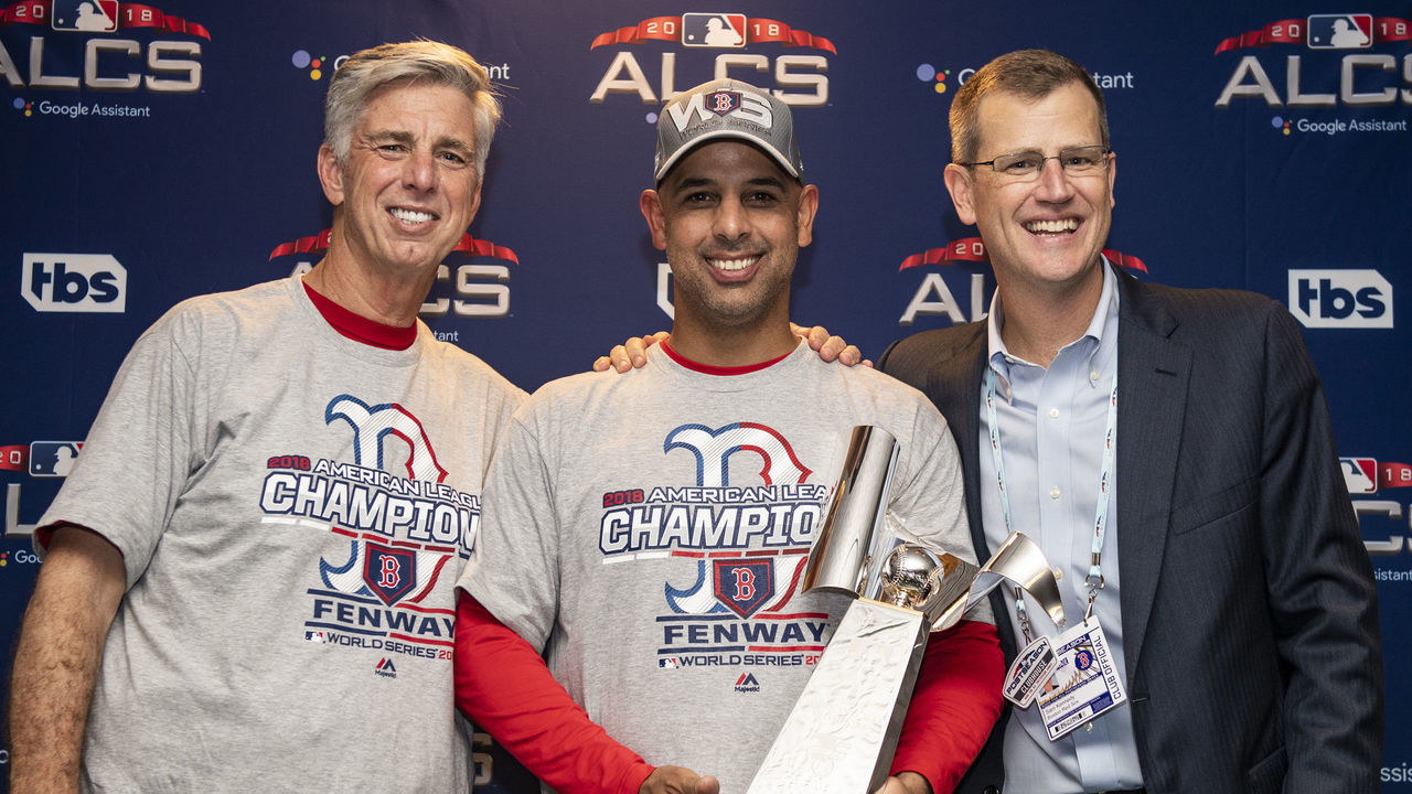 HOUSTON, TX - OCTOBER 18: President of Baseball Operations Dave Dombrowski, Manager Alex Cora, and President and CEO Sam Kennedy of the Boston Red Sox pose with the American League Championship trophy in the clubhouse after clinching the American League Championship Series in game five against the Houston Astros on October 18, 2018 at Minute Maid Park in Houston, Texas.