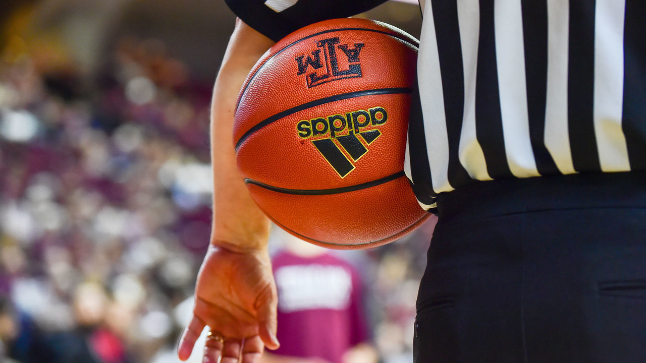 COLLEGE STATION, TX - JANUARY 11: The referee holds an Adidas basketball with an Aggie emblem during a timeout during the SEC Men's basketball game between the LSU Tigers and Texas A&M Aggies on January 11, 2017, at Reed Arena in College Station, Texas.