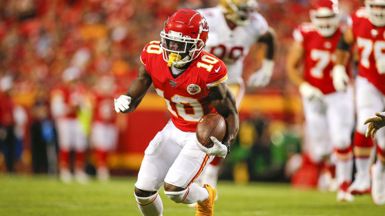 KANSAS CITY, MO - AUGUST 24: Tyreek Hill #10 of the Kansas City Chiefs runs for a 12-yard gain in preseason action against the San Francisco 49ers at Arrowhead Stadium on August 24, 2019 in Kansas City, Missouri.