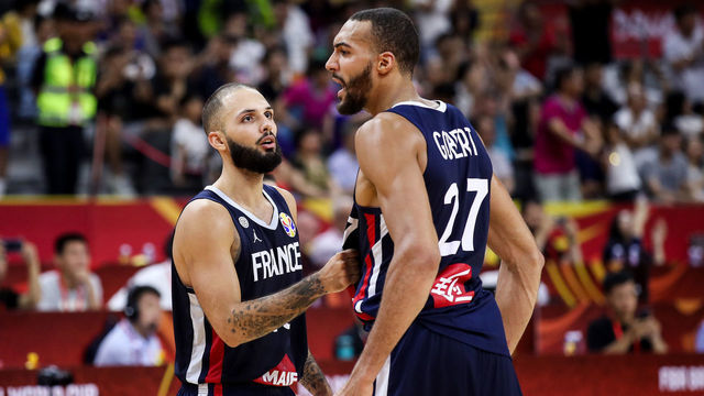 DONGGUAN, CHINA - SEPTEMBER 11: #27 Rudy Gobert of France celebrates the victory with teammate #10 Evan Fournier after the quarter final of 2019 FIBA World Cup between USA and France at Dongguan Basketball Center on September 11, 2019 in Dongguan, China.