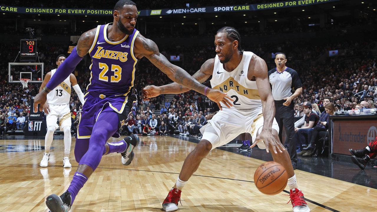 TORONTO, CANADA - MARCH 14: Kawhi Leonard #2 of the Toronto Raptors handles the ball against LeBron James #23 of the Los Angeles Lakers on March 14, 2019 at the Scotiabank Arena in Toronto, Ontario, Canada. Mandatory Copyright Notice: Copyright 2019 NBAE