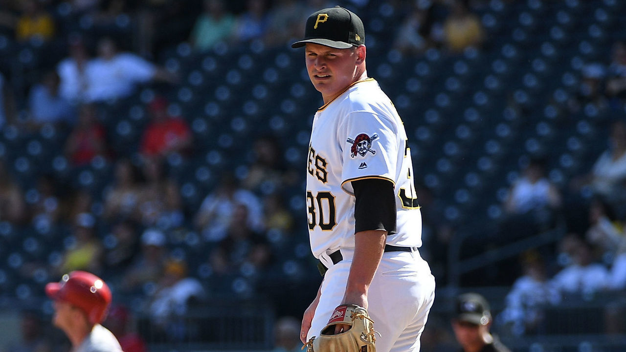 PITTSBURGH, PA - SEPTEMBER 03: Kyle Crick #30 of the Pittsburgh Pirates reacts as Scooter Gennett #3 of the Cincinnati Reds rounds the bases after hitting a solo home run in the eighth inning during the game at PNC Park on September 3, 2018 in Pittsburgh, Pennsylvania.