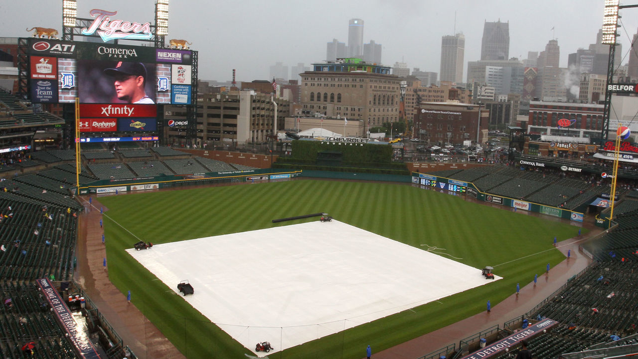 Comerica Park field covered by rain tarp for a rain delay during the baseball game between the Detroit Tigers and the Cleveland Indians in Detroit, Michigan USA, on Sunday, June 14, 2015.