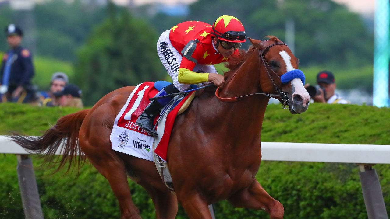 HEMPSTEAD, NY - JUNE 09: Justify ridden by Jockey Mikle Smith leaves the starting Gate on his way to winning the 150th Belmont Stakes and the Triple Crown on June 9, 2018 at Belmont Park in Hempstead, NY.