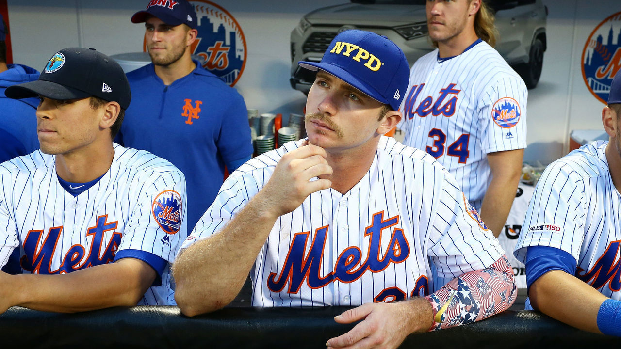 NEW YORK, NEW YORK - SEPTEMBER 11: Pete Alonso #20 of the New York Mets looks on wearing first responder caps in honor of the 18th anniversary of the September 11, 2001 terror attacks prior to the game against the Arizona Diamondbacks at Citi Field on September 11, 2019 in the Queens borough of New York City.