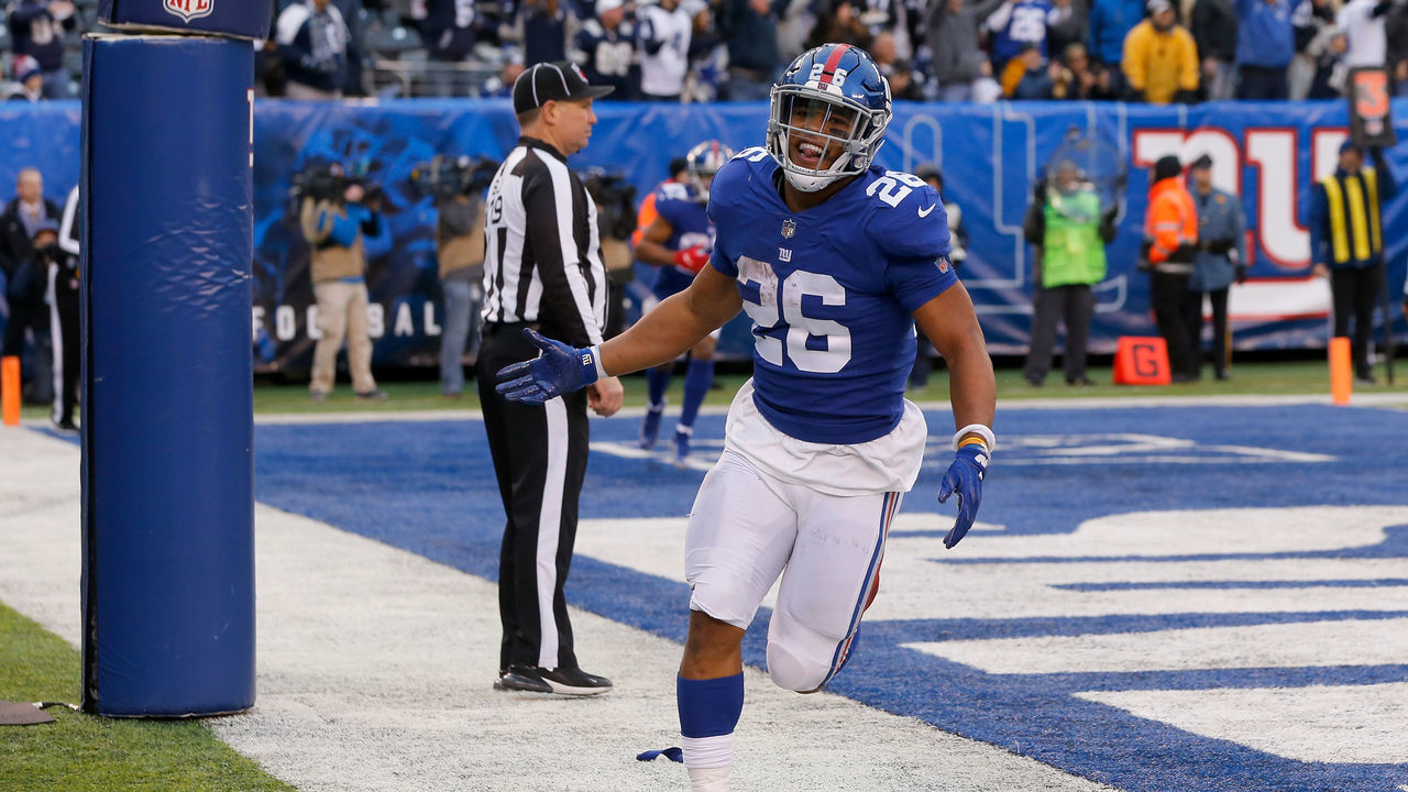 EAST RUTHERFORD, NJ - DECEMBER 30: (NEW YORK DAILIES OUT) Saquon Barkley #26 of the New York Giants celebrates a touchdown against the Dallas Cowboys on December 30, 2018 at MetLife Stadium in East Rutherford, New Jersey. The Cowboys defeated the Giants 36-35.