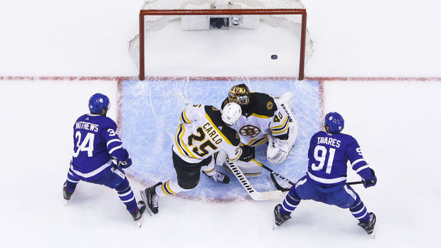 TORONTO, ON - APRIL 17: Auston Matthews #34 of the Toronto Maple Leafs scores with teammate John Tavares #91 against Tuukka Rask #40 and Brandon Carlo #25 of the Boston Bruins as during the third period during Game Four of the Eastern Conference First Round during the 2019 NHL Stanley Cup Playoffs at the Scotiabank Arena on April 17, 2019 in Toronto, Ontario, Canada.