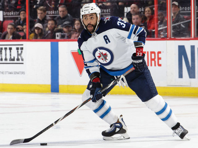 OTTAWA, ON - FEBRUARY 9: Dustin Byfuglien #33 of the Winnipeg Jets skates with the puck against the Ottawa Senators at Canadian Tire Centre on February 9, 2019 in Ottawa, Ontario, Canada.