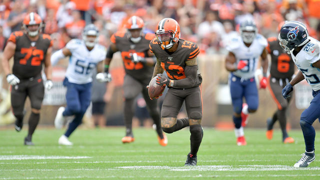 CLEVELAND, OHIO - SEPTEMBER 08: Wide receiver Odell Beckham #13 of the Cleveland Browns runs for extra yards after a reception while under pressure from cornerback Adoree' Jackson #25 of the Tennessee Titans during the first half at FirstEnergy Stadium on September 08, 2019 in Cleveland, Ohio.