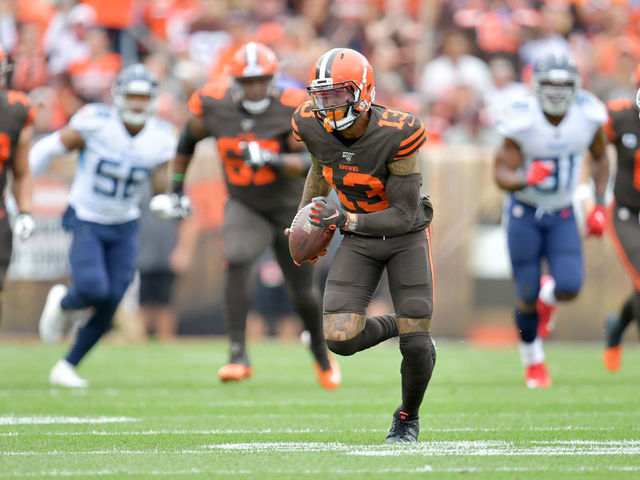 CLEVELAND, OHIO - SEPTEMBER 08: Wide receiver Odell Beckham #13 of the Cleveland Browns runs for extra yards after a reception while under pressure from cornerback Adoree' Jackson #25 of the Tennessee Titans during the first half at FirstEnergy Stadium on September 08, 2019 in Cleveland, Ohio.