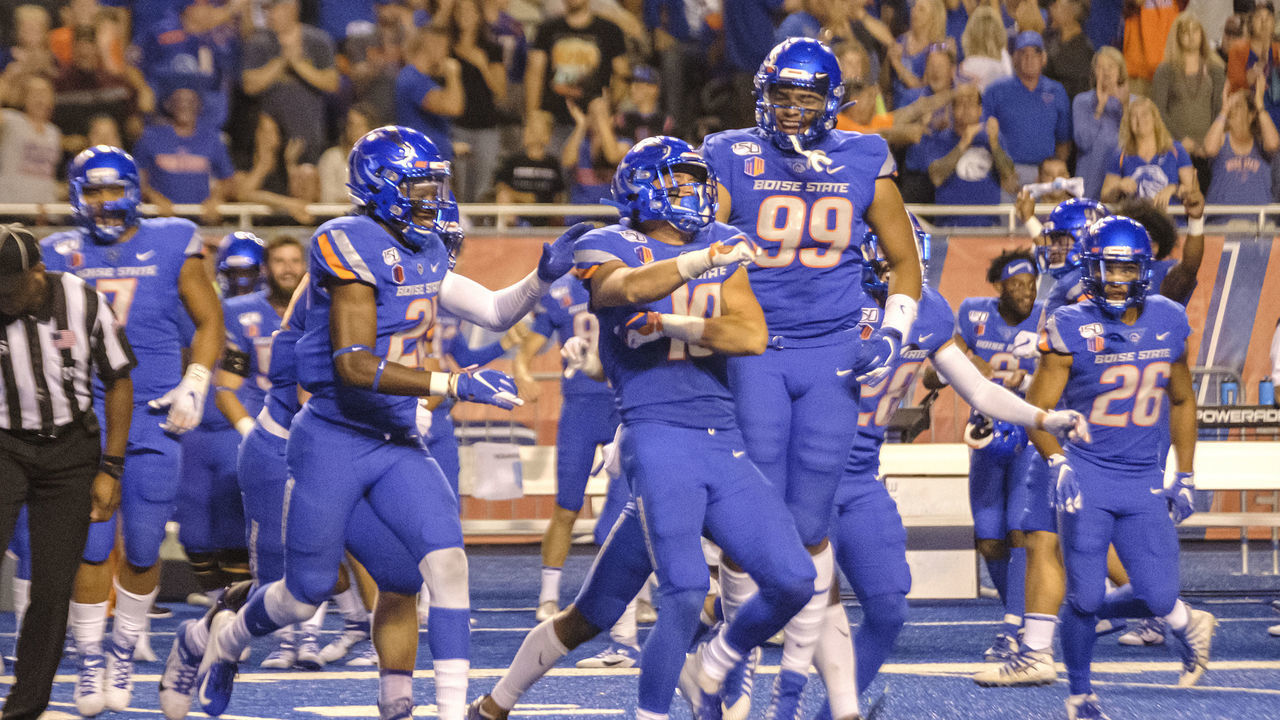 BOISE, ID - SEPTEMBER 06: Boise State Broncos safety Kekoa Nawahine (10) celebrates with teammates his pass interception late in the preseason game between Marshall and Boise State on Friday, September 06, 2019 at Albertson's Stadium in Boise, Idaho.
