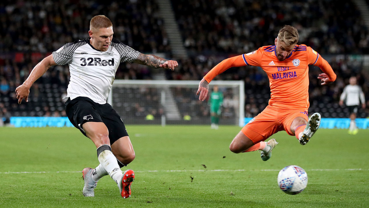 Derby County's Martyn Waghorn (left) has a shot on goal under pressure from Cardiff City's Joe Bennett during the Sky Bet Championship match at Pride Park, Derby.