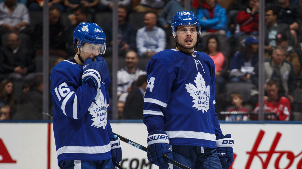TORONTO, ON - JANUARY 23: Auston Matthews #34 of the Toronto Maple Leafs talks with teammate Mitch Marner #16 after a whistle during the third period against the Washington Capitals at the Scotiabank Arena on January 23, 2019 in Toronto, Ontario, Canada.