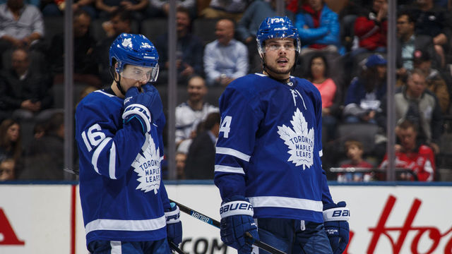 TORONTO, ON - JANUARY 23: Auston Matthews #34 of the Toronto Maple Leafs talks with teammate Mitch Marner #16 after a whistle during the third period against the Washington Capitals at the Scotiabank Arena on January 23, 2019 in Toronto, Ontario, Canada.