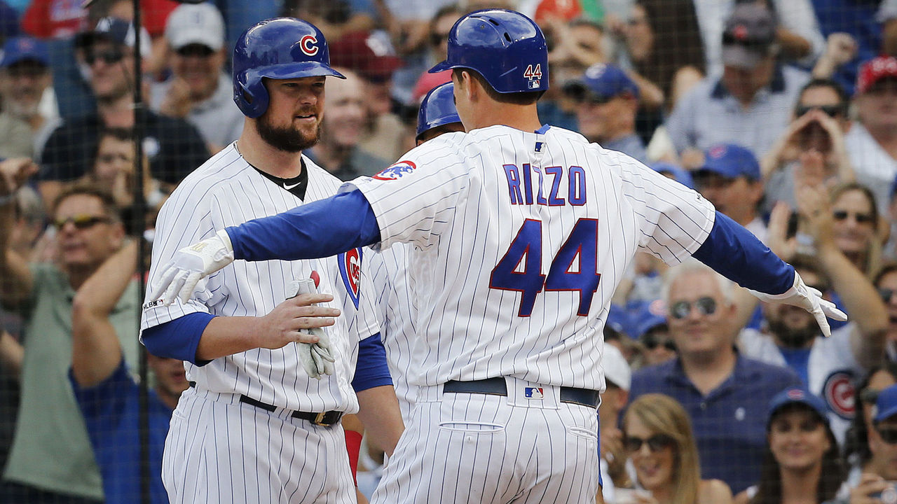 Cubs win on wild pitch after Rizzo hits slam in first