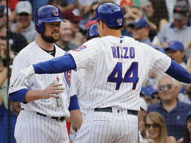 Chicago Cubs' Nico Hoerner (2) celebrates with manager Joe Maddon