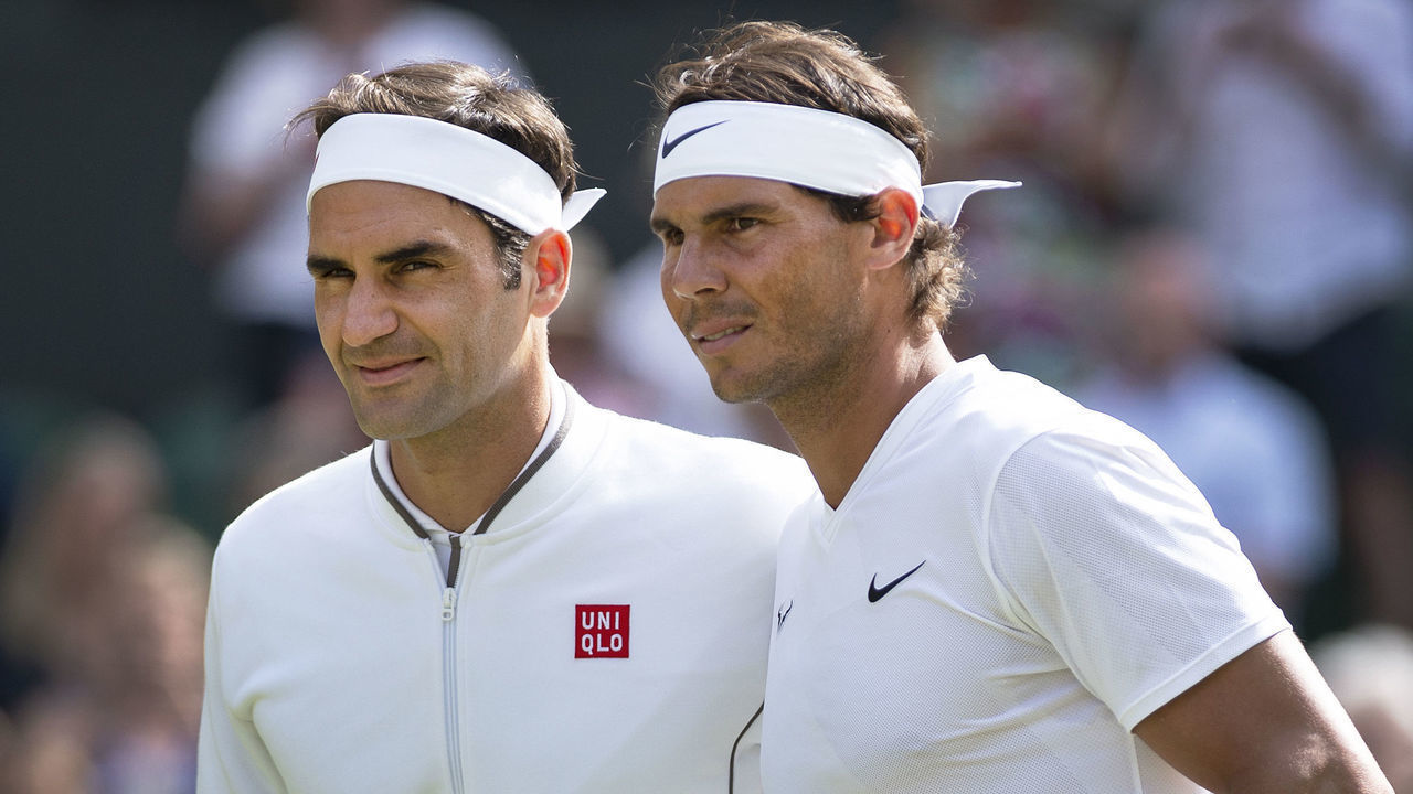 LONDON, ENGLAND - JULY 12: Roger Federer of Switzerland and Rafael Nadal of Spain pose at the net before their semi final match during Day Eleven of The Championships - Wimbledon 2019 at All England Lawn Tennis and Croquet Club on July 12, 2019 in London, England.