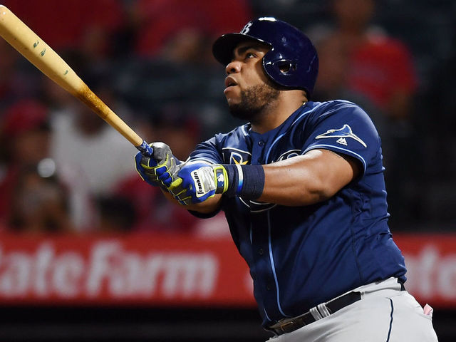ANAHEIM, CA - SEPTEMBER 13: Tampa Bay Rays first baseman Jesus Aguilar (21) drives in a run on a sacrifice fly in the ninth inning of a game against the Los Angeles Angels played on September 13, 2019 at Angel Stadium of Anaheim in Anaheim, CA.