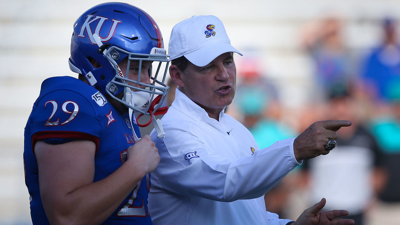 LAWRENCE, KS - SEPTEMBER 07: Kansas Jayhawks head coach Les Miles gives coaching advice to fullback Ben Miles (29) before an FBS football game between the Coastal Carolina Chanticleers and Kansas Jayhawks on September 7, 2019 at Memorial Stadium in Lawrence, KS.