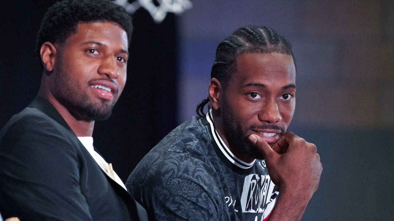 LOS ANGELES, CA - JULY 24: New Clippers players Paul George, left, and Kawhi Leonard attend a press conference at the Green Meadows Recreation Center in Los Angeles on Wednesday, July 24, 2019. George and Leonard were introduced to the media and fans as the newest members of the Clippers.
