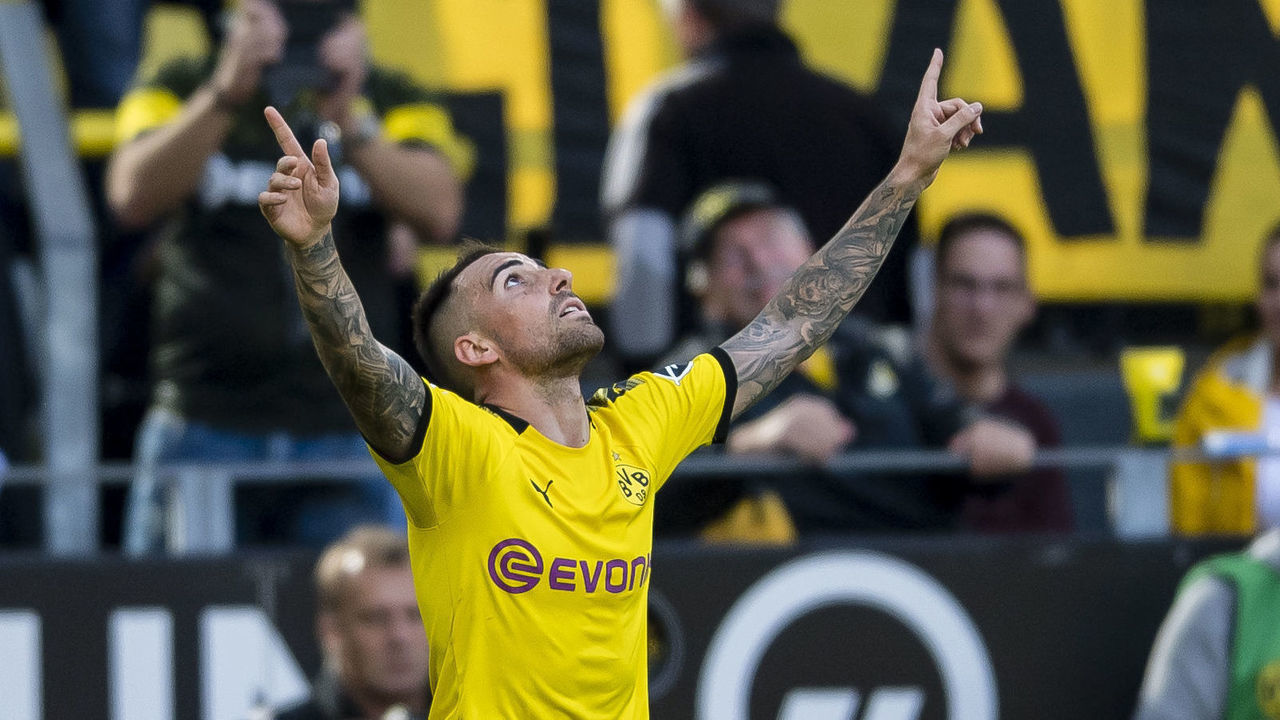 DORTMUND, GERMANY - SEPTEMBER 14: Paco Alcacer of Borussia Dortmund celebrates after scoring the opening goal during the Bundesliga match between Borussia Dortmund and Bayer 04 Leverkusen at the Signal Iduna Park on September 14, 2019 in Dortmund, Germany.