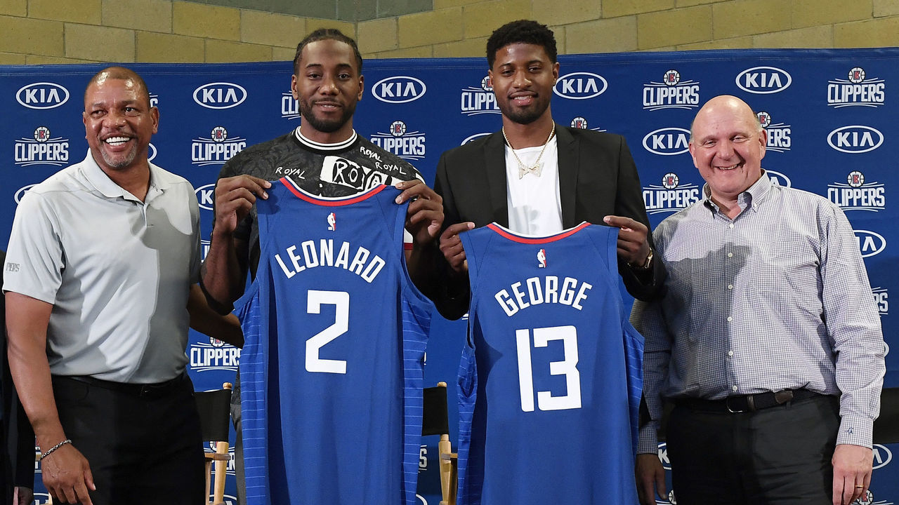 LOS ANGELES, CA - JULY 24: (L-R) Head coach Doc Rivers, Paul George, Kawhi Leonard and owner Steve Ballmer of the Los Angeles Clippers attend the Paul George and Kawhi Leonard introductory press conference at Green Meadows Recreation Center on July 24, 2019 in Los Angeles, California.
