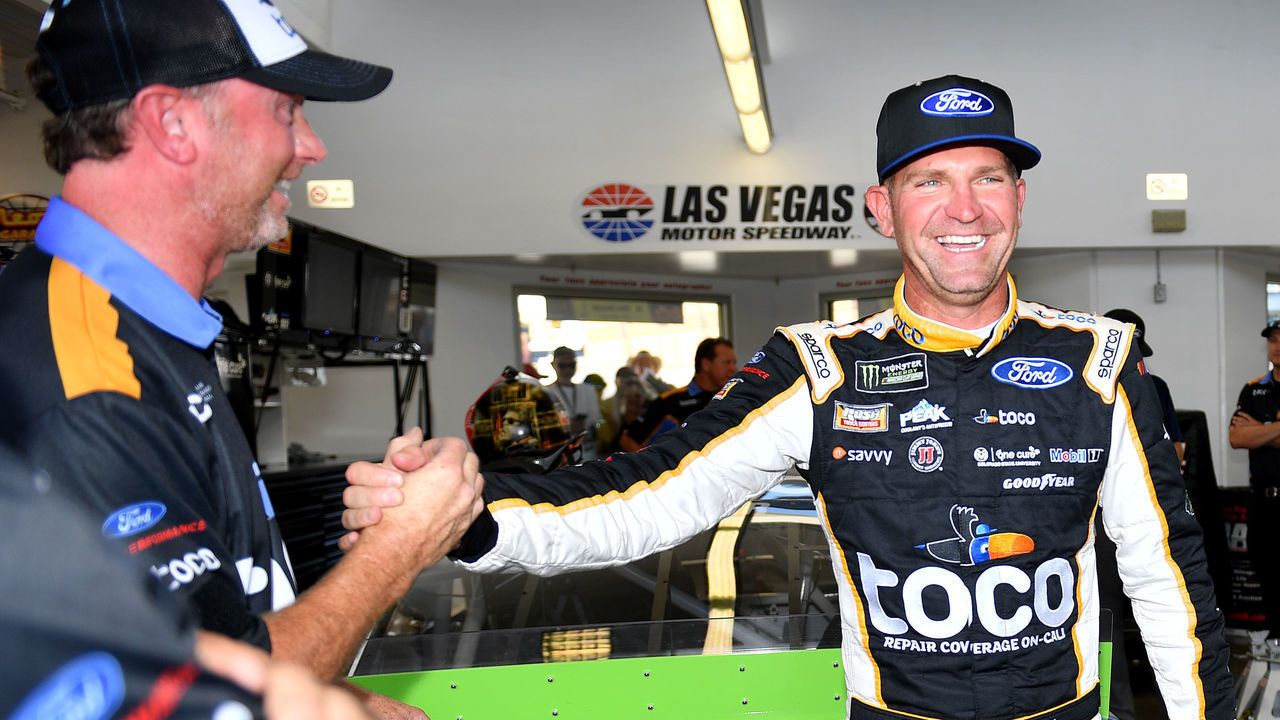 LAS VEGAS, NV - SEPTEMBER 14: Monster Energy NASCAR Cup Series driver Clint Bowyer (14) Stewart Haas Racing Ford Mustang celebrates with a crew member after winning the pole for the South Point 400 playoff race Saturday Sept. 14, 2019 at Las Vegas Motor Speedway in Las Vegas, Nevada. It is Bowyers first pole since 2007, a span of 432 races.