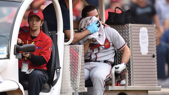 WASHINGTON, DC - SEPTEMBER 14: Medical staff takes Charlie Culberson #8 of the Atlanta Braves off the field after getting hit by a ball in the seventh inning during a baseball game against the Washington Nationals at Nationals Park on September 14, 2019 in Washington, DC.