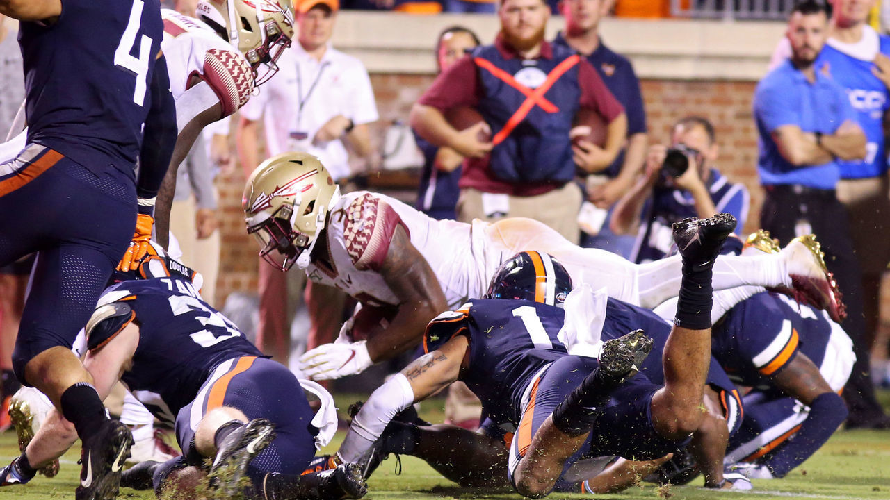 CHARLOTTESVILLE, VA - SEPTEMBER 14: Cam Akers #3 of the Florida State Seminoles is stopped short of the goal line on the final play of the second half during a game against the Virginia Cavaliers at Scott Stadium on September 14, 2019 in Charlottesville, Virginia.