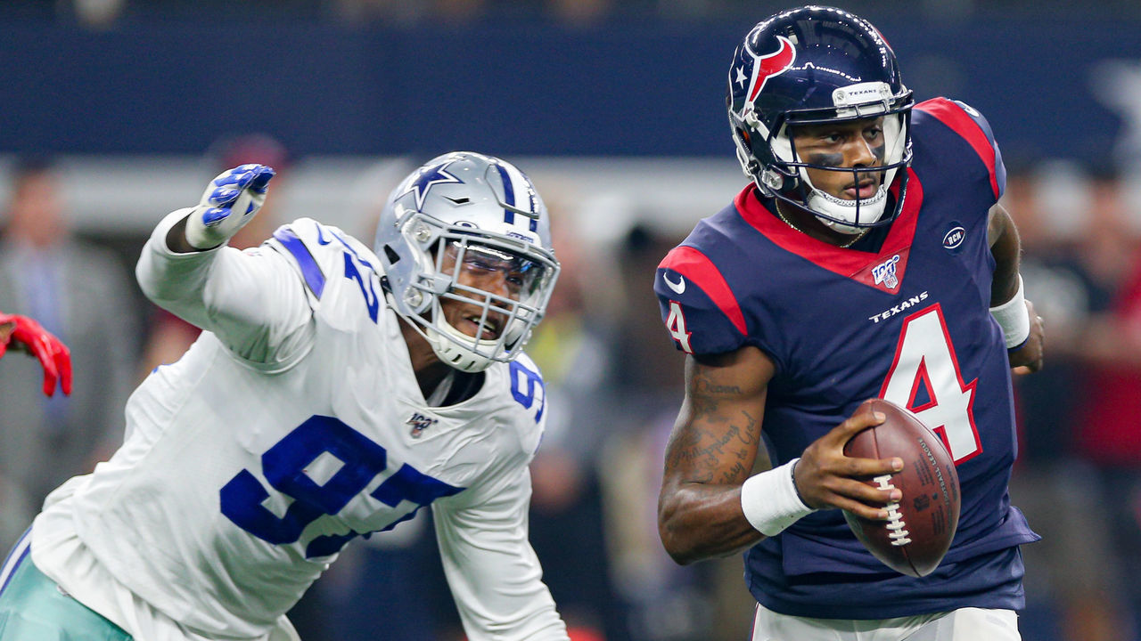 ARLINGTON, TX - AUGUST 24: Houston Texans quarterback Deshaun Watson (4) is chased Dallas Cowboys defensive end Taco Charlton (97) during the preseason game between the Houston Texans and Dallas Cowboys on August 24, 2019 at AT&T Stadium in Arlington, TX.