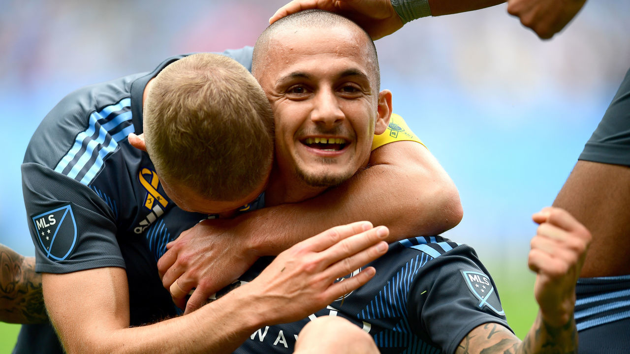 NEW YORK, NEW YORK - SEPTEMBER 14: Alexander Ring #8 of New York City FC hugs Alexandru Mitrita #28 of New York City FC after Mitrita scores the second goal during the first half of their game against San Jose at Yankee Stadium on September 14, 2019 in the Bronx borough of New York City.