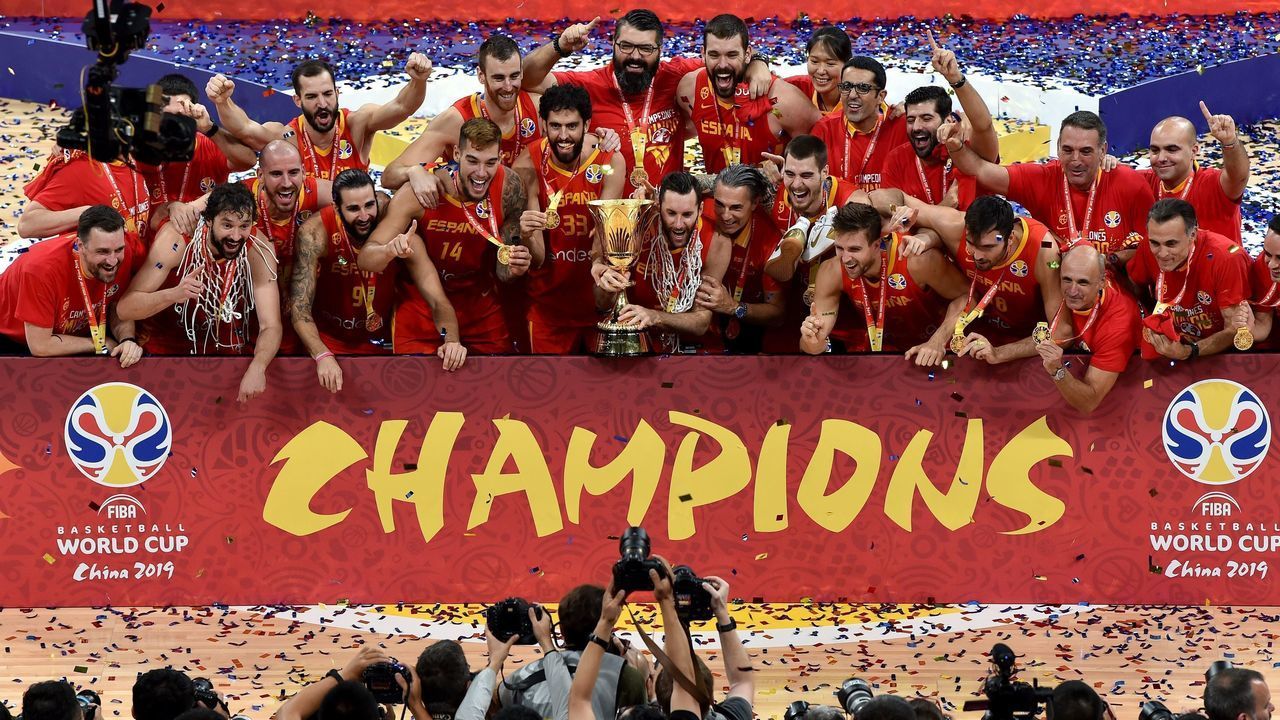Spain's players pose for pictures as they celebrate with the trophy after winning the Basketball World Cup final game against Argentina in Beijing on September 15, 2019.