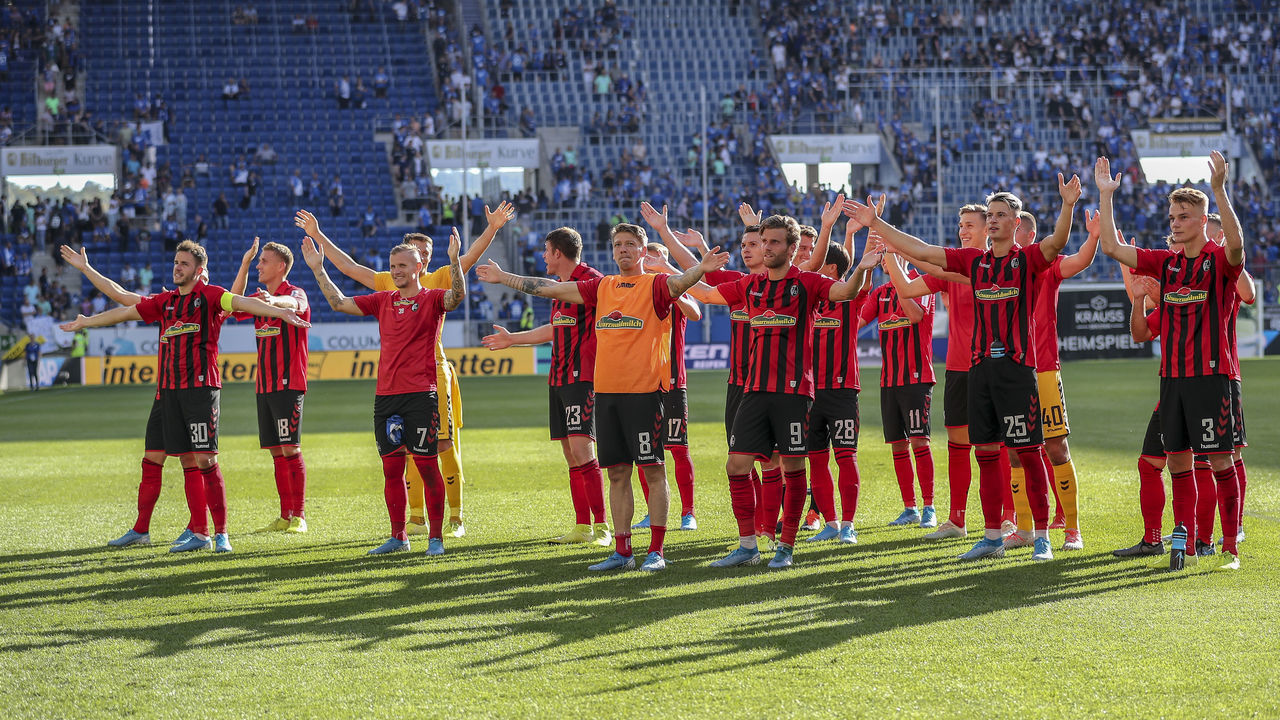 SINSHEIM, GERMANY - SEPTEMBER 15: Players of Sport-Club Freiburg celebrate with fans after the Bundesliga match between TSG 1899 Hoffenheim and Sport-Club Freiburg at PreZero-Arena on September 15, 2019 in Sinsheim, Germany.