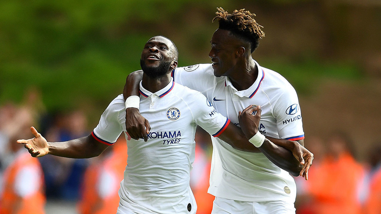 WOLVERHAMPTON, ENGLAND - SEPTEMBER 14: Fikayo Tomori of Chelsea celebrates with teammate Tammy Abraham after scoring his team's first goal during the Premier League match between Wolverhampton Wanderers and Chelsea FC at Molineux on September 14, 2019 in Wolverhampton, United Kingdom.