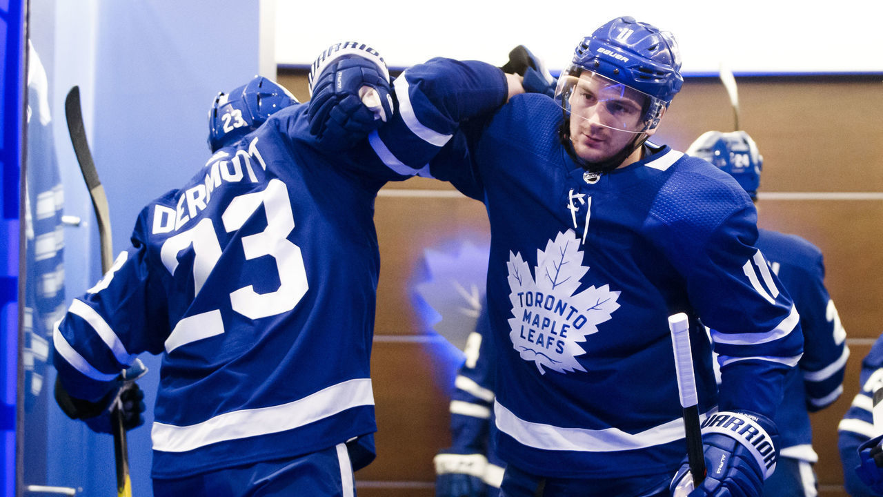 TORONTO, ON - APRIL 15: Zach Hyman #11 and Travis Dermott #23 of the Toronto Maple Leafs in the dressing room ahead of playing the Boston Bruins in Game Three of the Eastern Conference First Round during the 2019 NHL Stanley Cup Playoffs at the Scotiabank Arena on April 15, 2019 in Toronto, Ontario, Canada.